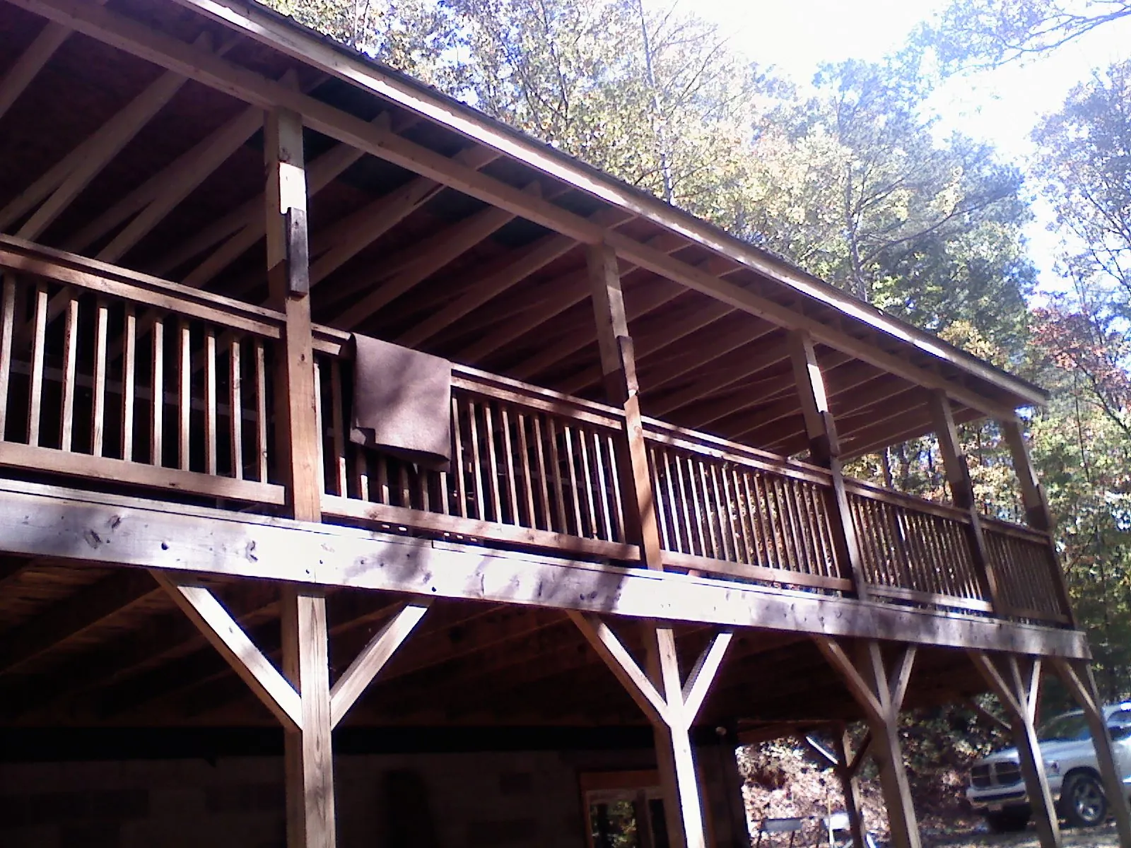 Timber framing under a new elevated porch and deck — Roof Leak Repair in New Era by Roofing Brothers